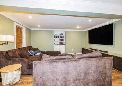 Basement living room with custom built-ins in Oakton, VA